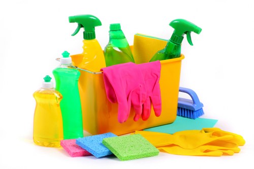 Cleaner wearing PPE while handling carpet cleaning equipment